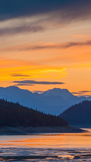 Sunset over mountains and lake 4K