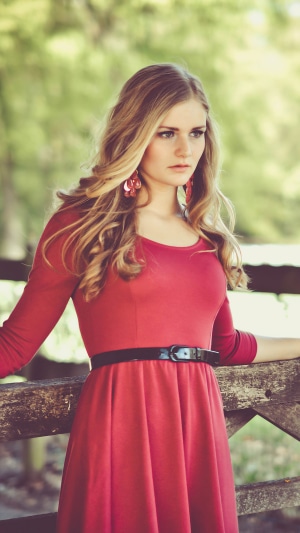 Model in red dress with earrings