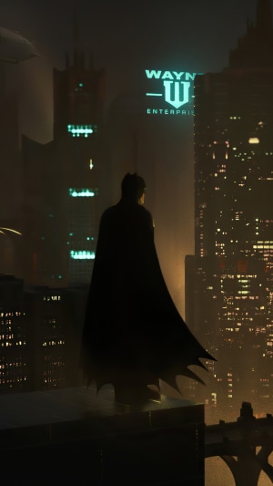 Batman overlooking Gotham City with Wayne Enterprises sign