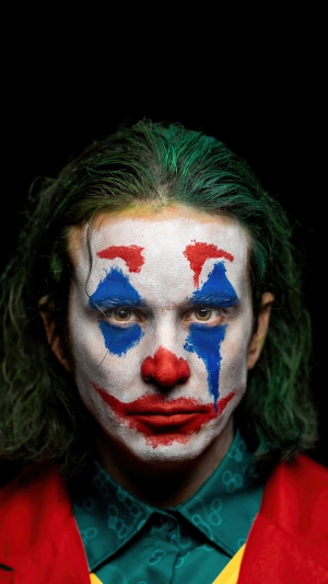 Man in Joker cosplay with green hair