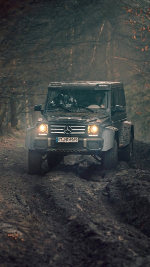 Mercedes-Benz G-Class driving through mud