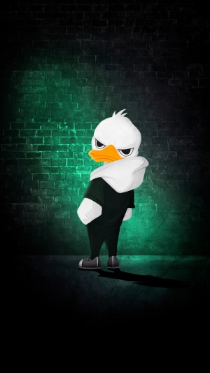 Cartoon duck wearing a hoodie in front of a brick wall