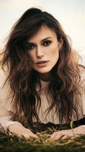 Keira Knightley lying in grass