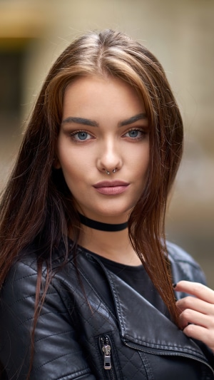 Brunette model with septum piercing and choker