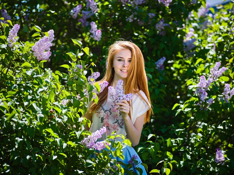 Redhead girl with lilac