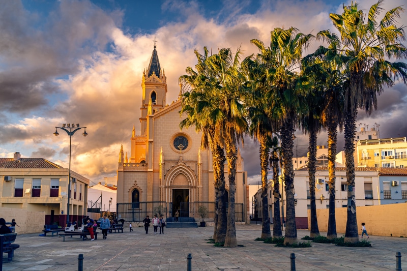 Church and palm trees in Malaga, Spain