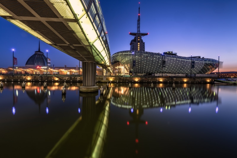 Modern architecture and bridge over water at dusk in Bremerhaven, Germany