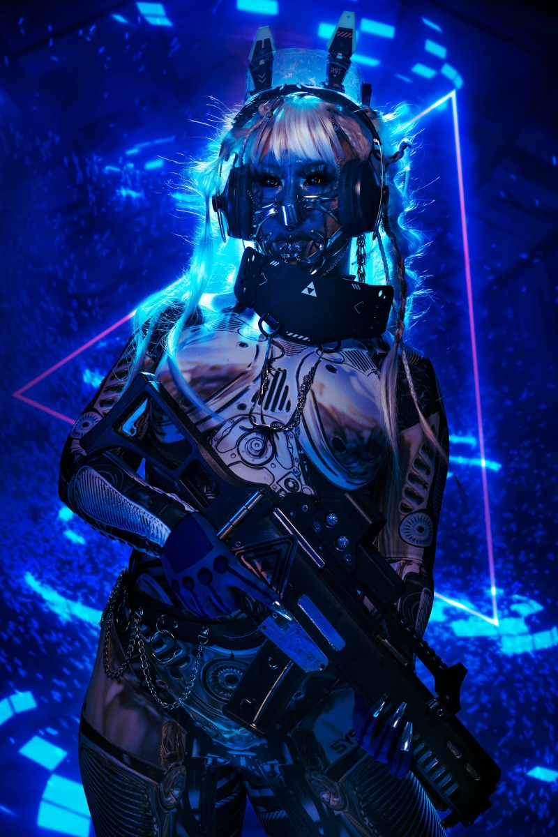 Cosplayer with assault rifle and headphones