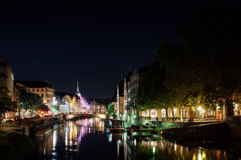 Strasbourg at Night with Riverboat and Bridge