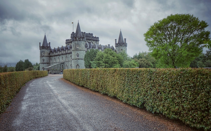 Inveraray Castle, Scotland, with a road and hedge