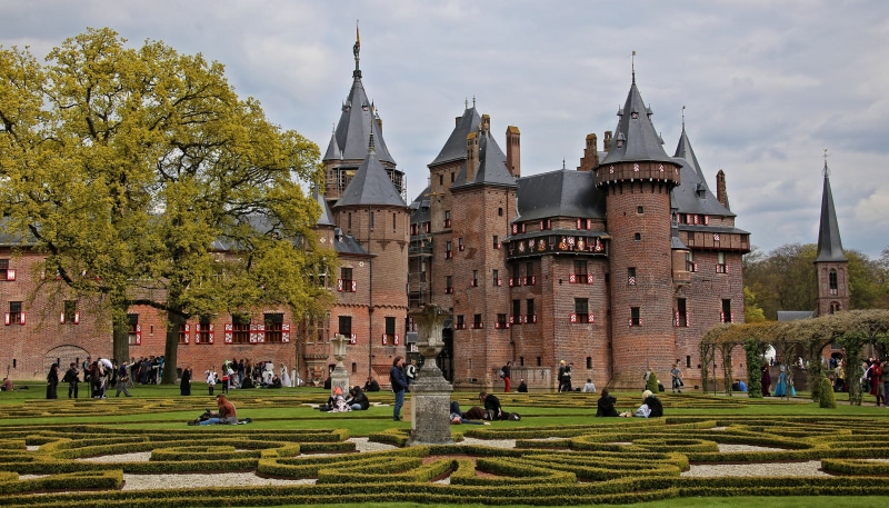 De Haar Castle, Netherlands with people in a garden