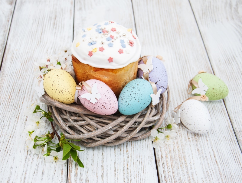 Easter cake and decorated eggs in a nest