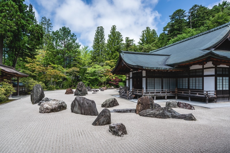 Japanese Zen Garden with Temple and Rocks