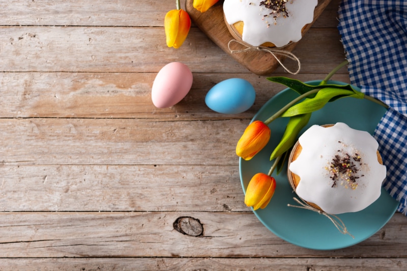 Easter Kulich cakes with tulips and eggs
