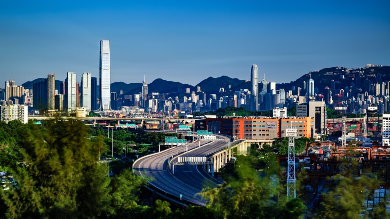 Hong Kong Skyline with Mountains and Roads
