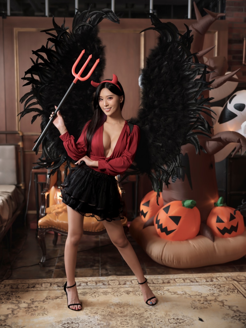 Woman in Devil Costume with Wings and Trident