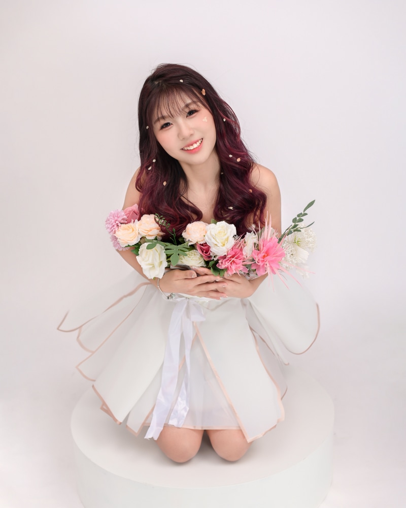 Asian woman with flowers posing