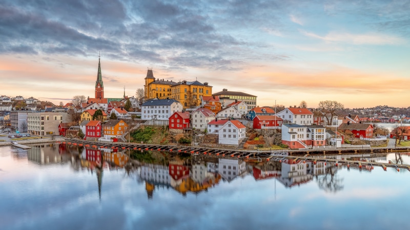Arendal, Norway waterfront with colorful houses and reflection