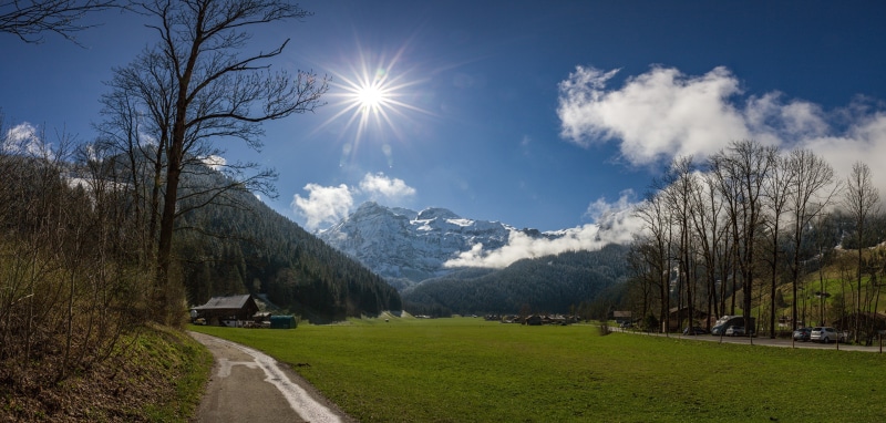 Lenk, Switzerland: Sunlit Alps with a Meadow and Path