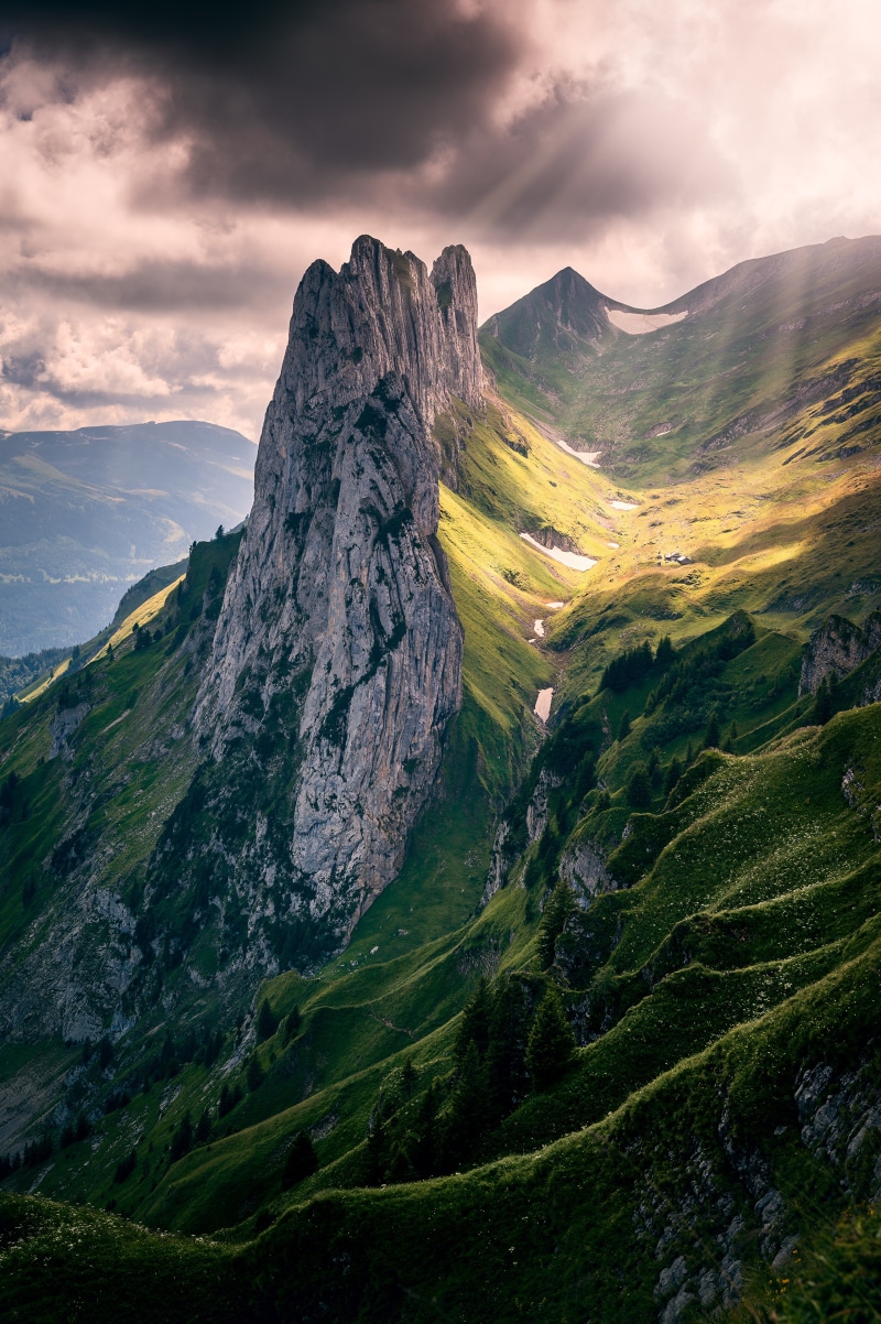Dramatic mountain landscape with sunbeams in the Alps