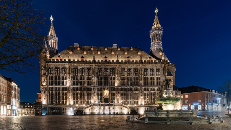 Aachen City Hall at night with fountain