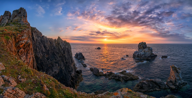 Sunset over the rocky coast of Plomeur, France