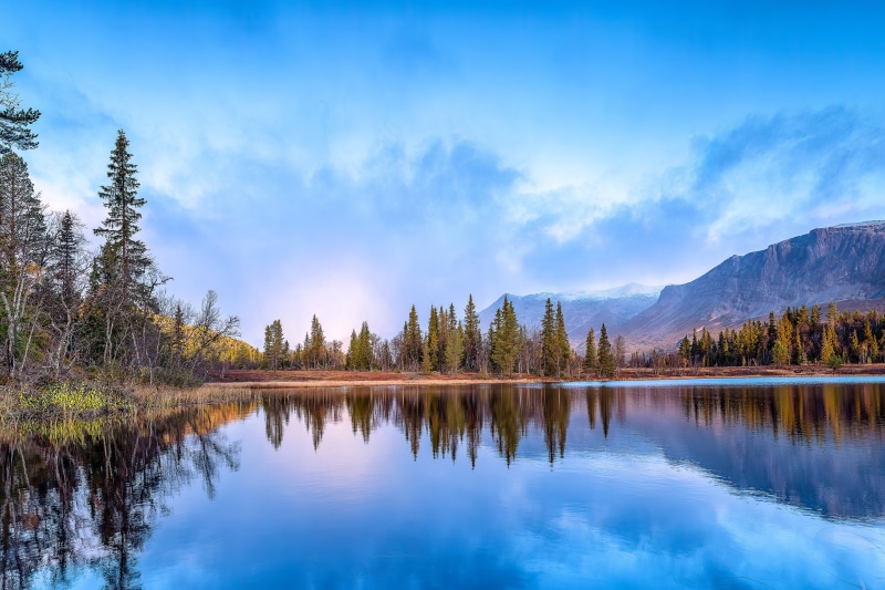 4K Lake Reflection with Mountains and Trees in Norway