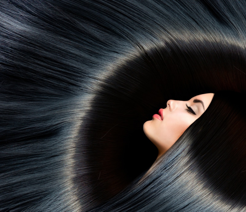 Brunette girl with long black hair and makeup