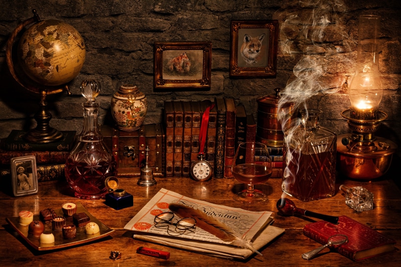 Desk with globe, books, and smoking pipe