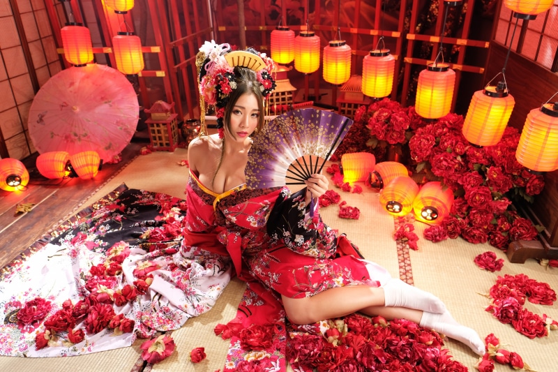 Woman in Kimono with Hand Fan and Lanterns