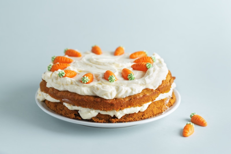 Carrot cake with cream cheese frosting and carrot decorations
