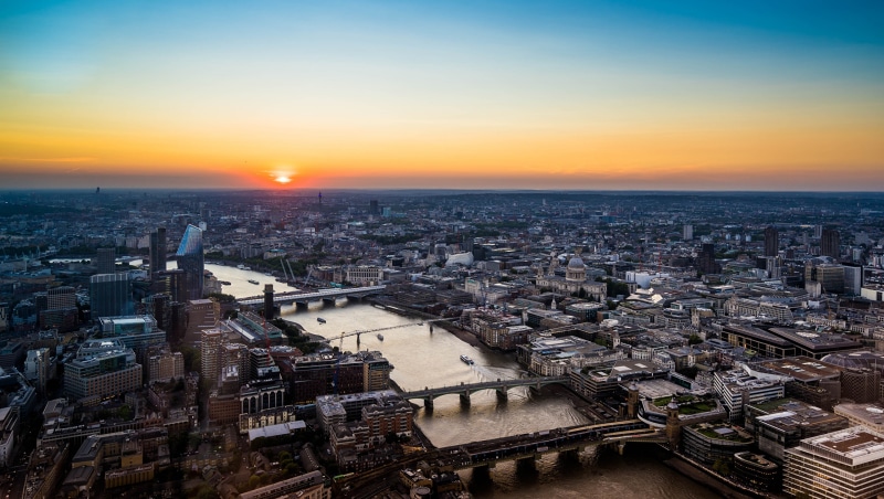 London skyline at sunset with River Thames and bridges