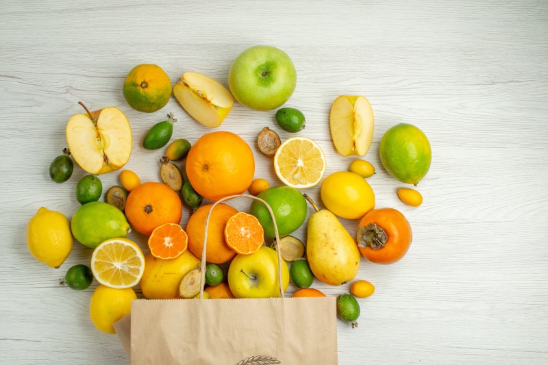 Assortment of Fruits and Paper Bag