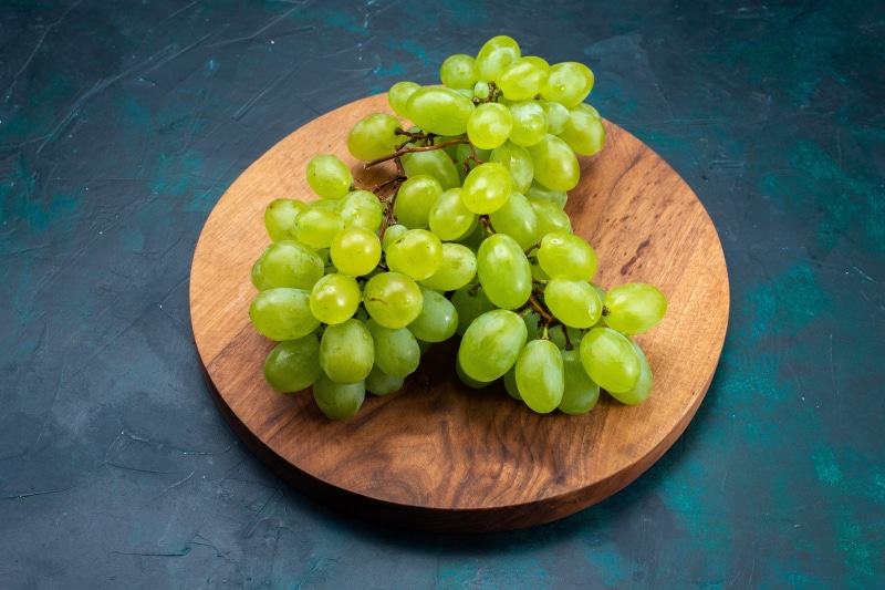 Green Grapes on a Wooden Tray