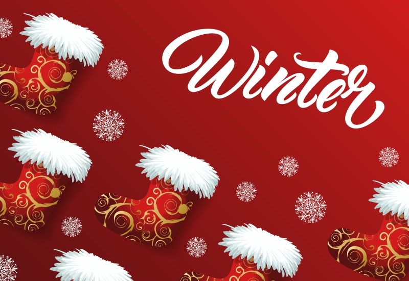 Winter themed Christmas stockings and snowflakes on red background
