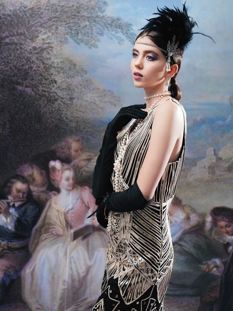 Woman in 1920s flapper dress and accessories