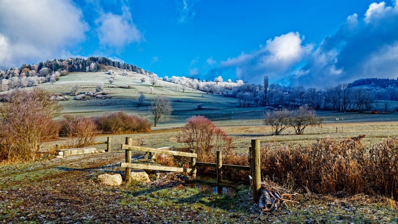 Frosty landscape in Savoie, France with mountains and clouds
