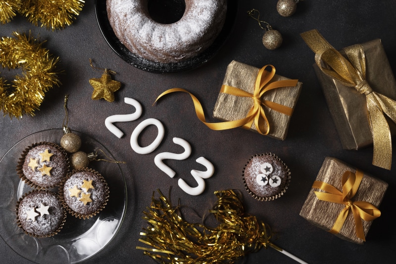 New Year 2023 celebration with cake and gifts