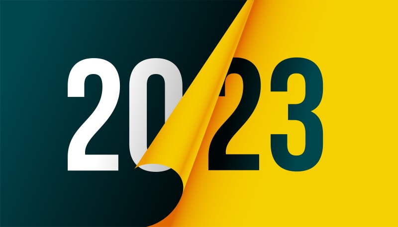 2023 New Year graphic with peeling yellow paper