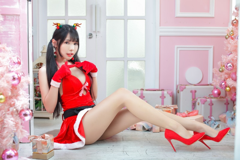 Asian girl in Christmas outfit posing