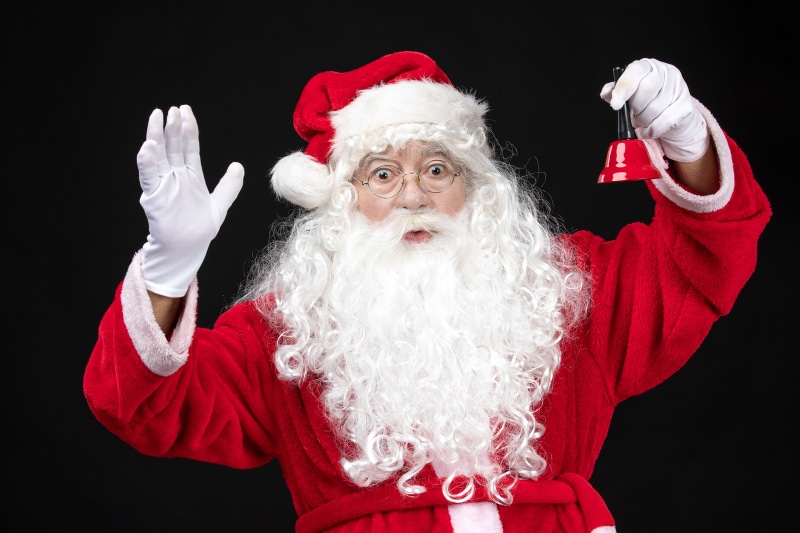 Santa Claus holding a bell
