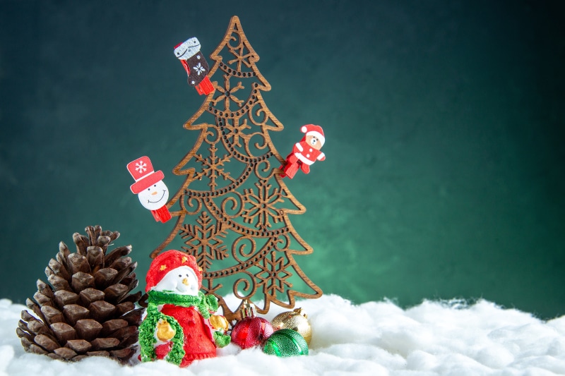 Christmas tree with decorations and pine cone