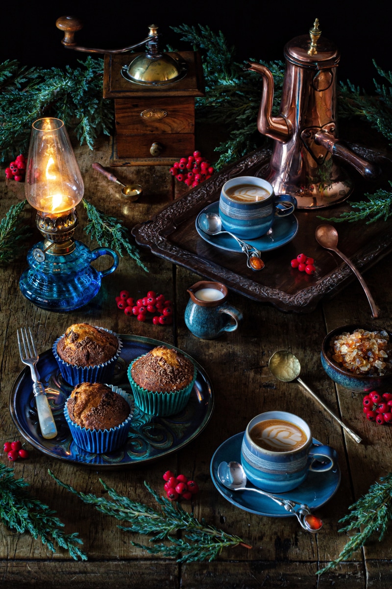 Still life with muffins, coffee, and vintage coffee mill