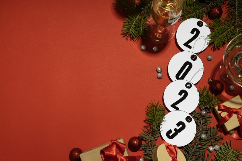 Christmas 2023 greeting card with gifts and champagne