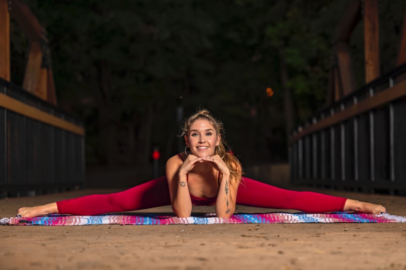 Amanda doing a split stretch exercise