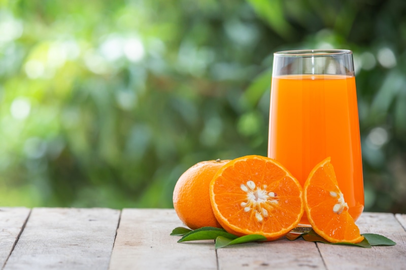 Orange fruit and juice in a glass