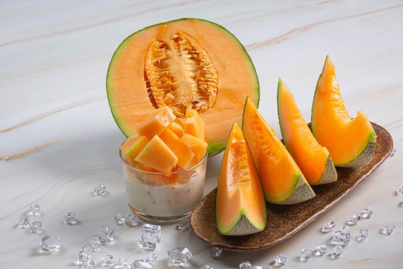 Cantaloupe Melon Slices and Cubes with Ice