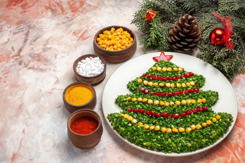 Christmas tree salad with spices and pine cone