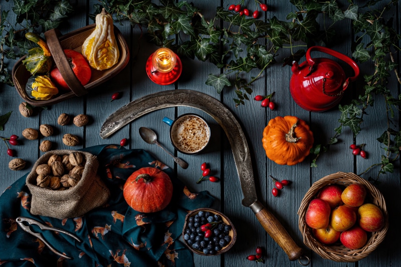 Still-life with pumpkins, apples, walnuts, blueberries, and kettle