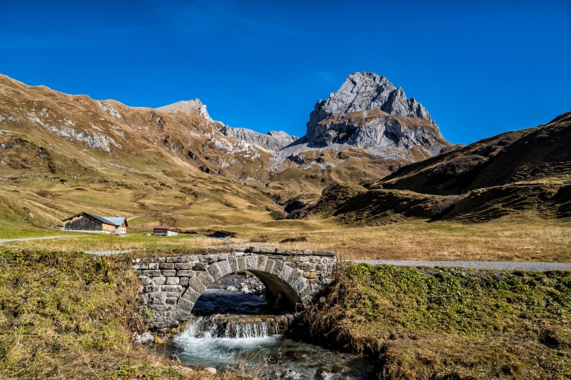 Stone bridge over a stream in the Austrian Alps